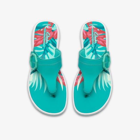 Pair of teal flip-flops with decorative buckle and floral design.