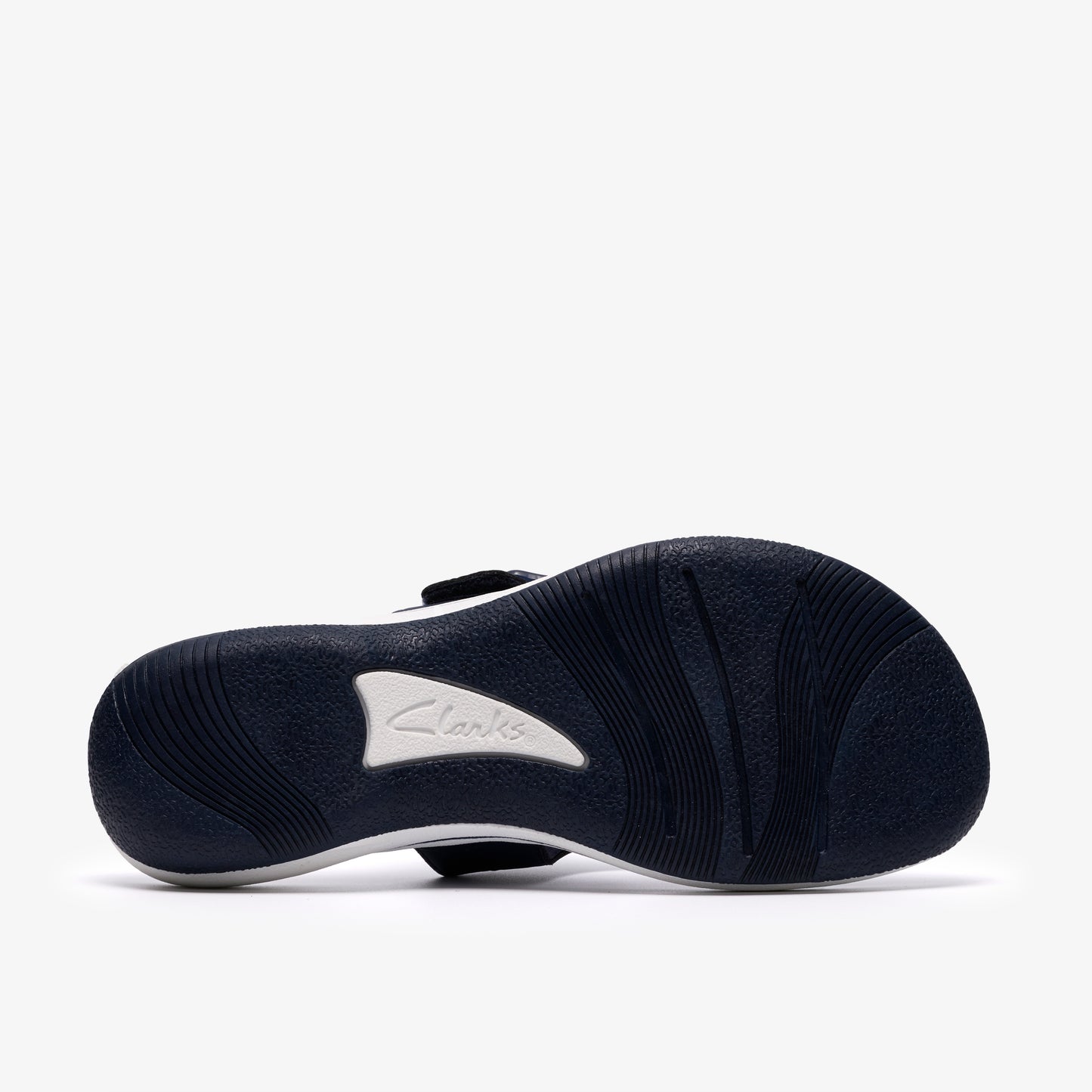 The sole of a navy blue sandal with white "Clarks" logo.
