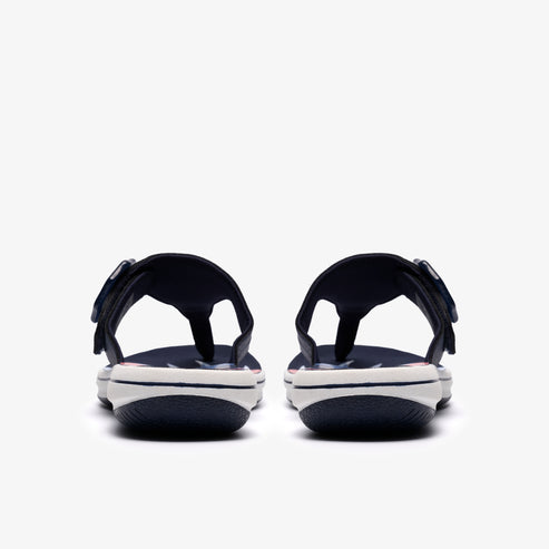Pair of navy and white sandals with toe posts, viewed from the back.