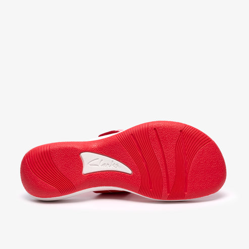 Red sandal sole with white logo.