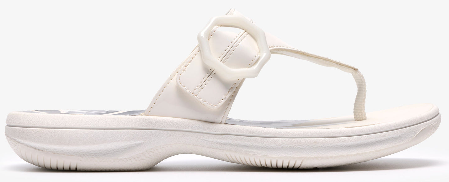 A white thong sandal with a decorative buckle.