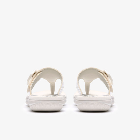 Pair of white flip-flops with flower detail from rear view.