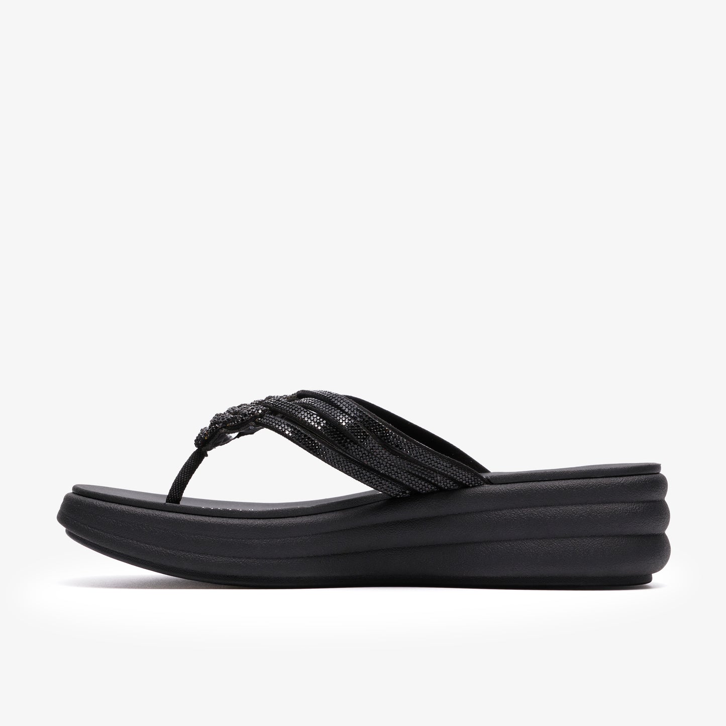 Black flip-flop sandal with embellished, twisted straps and platform sole.