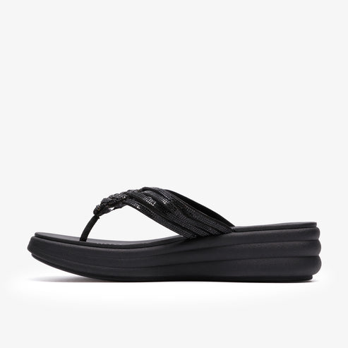 Black flip-flop sandal with embellished, twisted straps and platform sole.