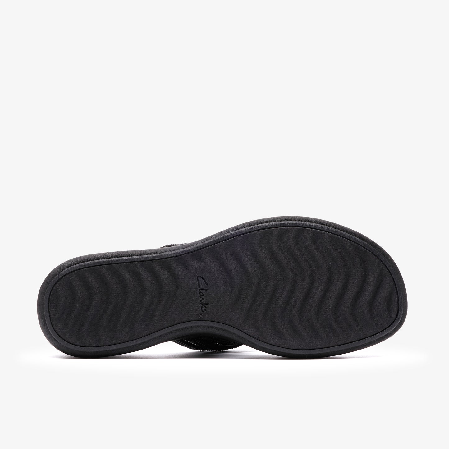 Black sandal sole with a wavy pattern and the word "Clarks" embossed in the center.