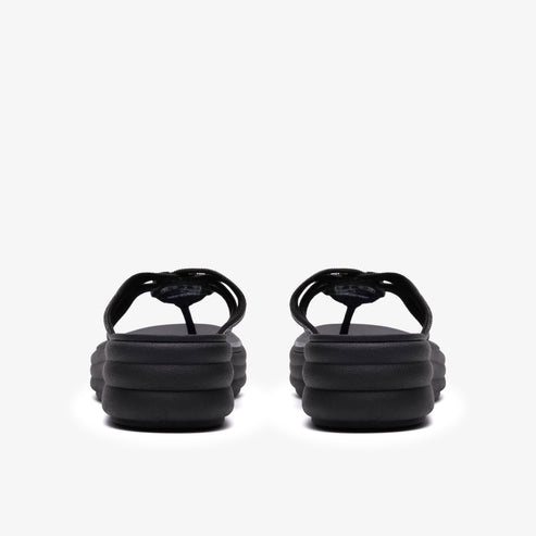 Elevated, black platform flip-flops with a thong strap; rear view.
