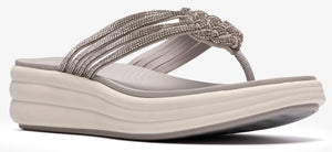 A gray sandal with a thick white sole, adorned with woven straps.