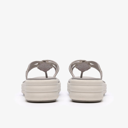 Pair of gray thong sandals with a platform sole, seen from the back.