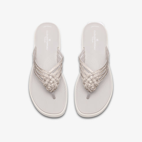Pair of white flip-flops with woven straps.