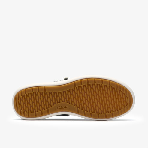 A shoe sole with horizontal and vertical ridges on brown tread and “Clarks” text near the center.