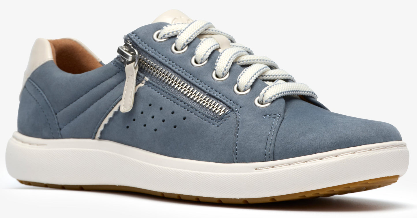 Low-top blue sneaker with white sole, laces, and heel tab; silver zipper detail on the side.
