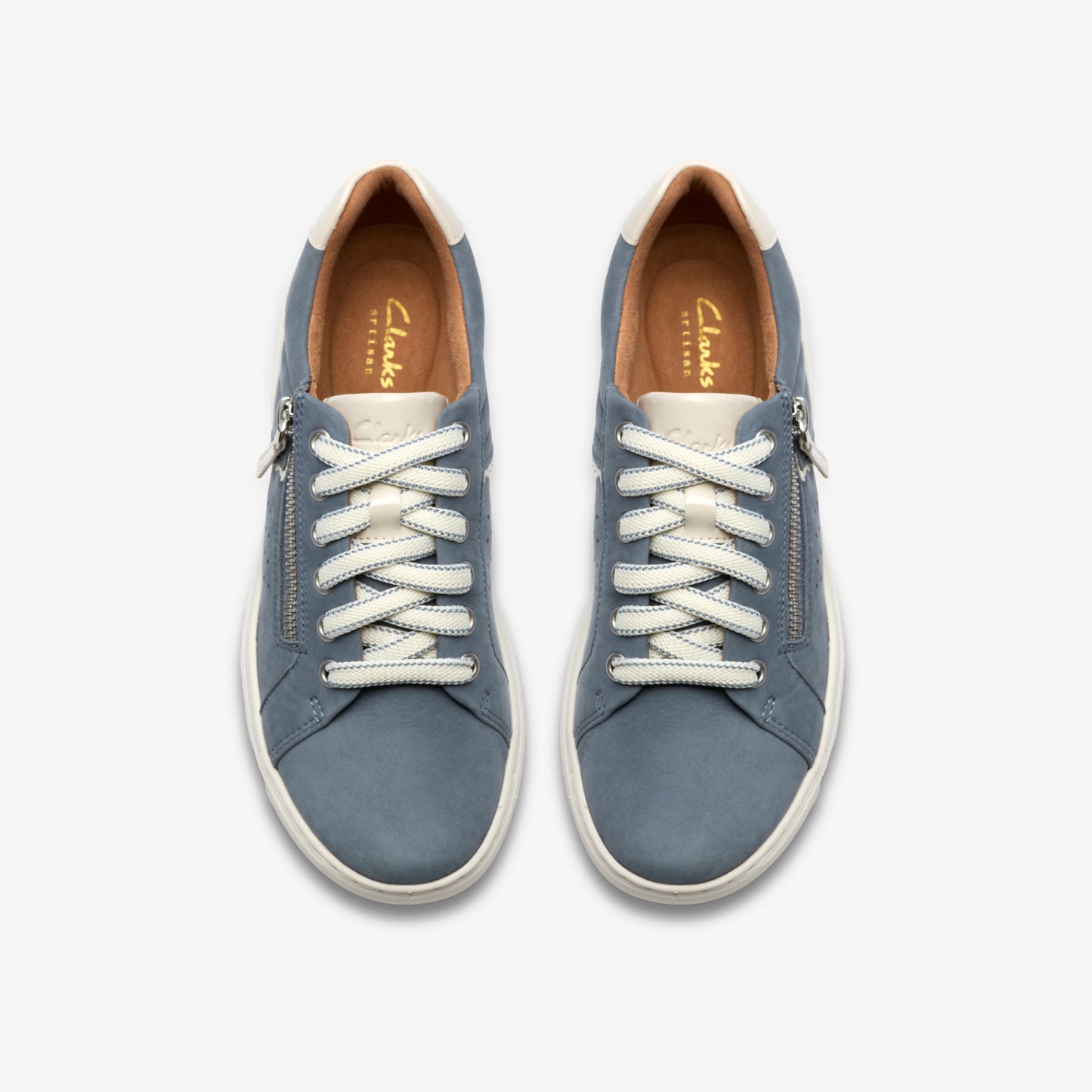 A pair of blue leather sneakers with white laces and a zipper on the side.