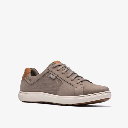 Taupe sneaker with tan leather accents and off-white sole.