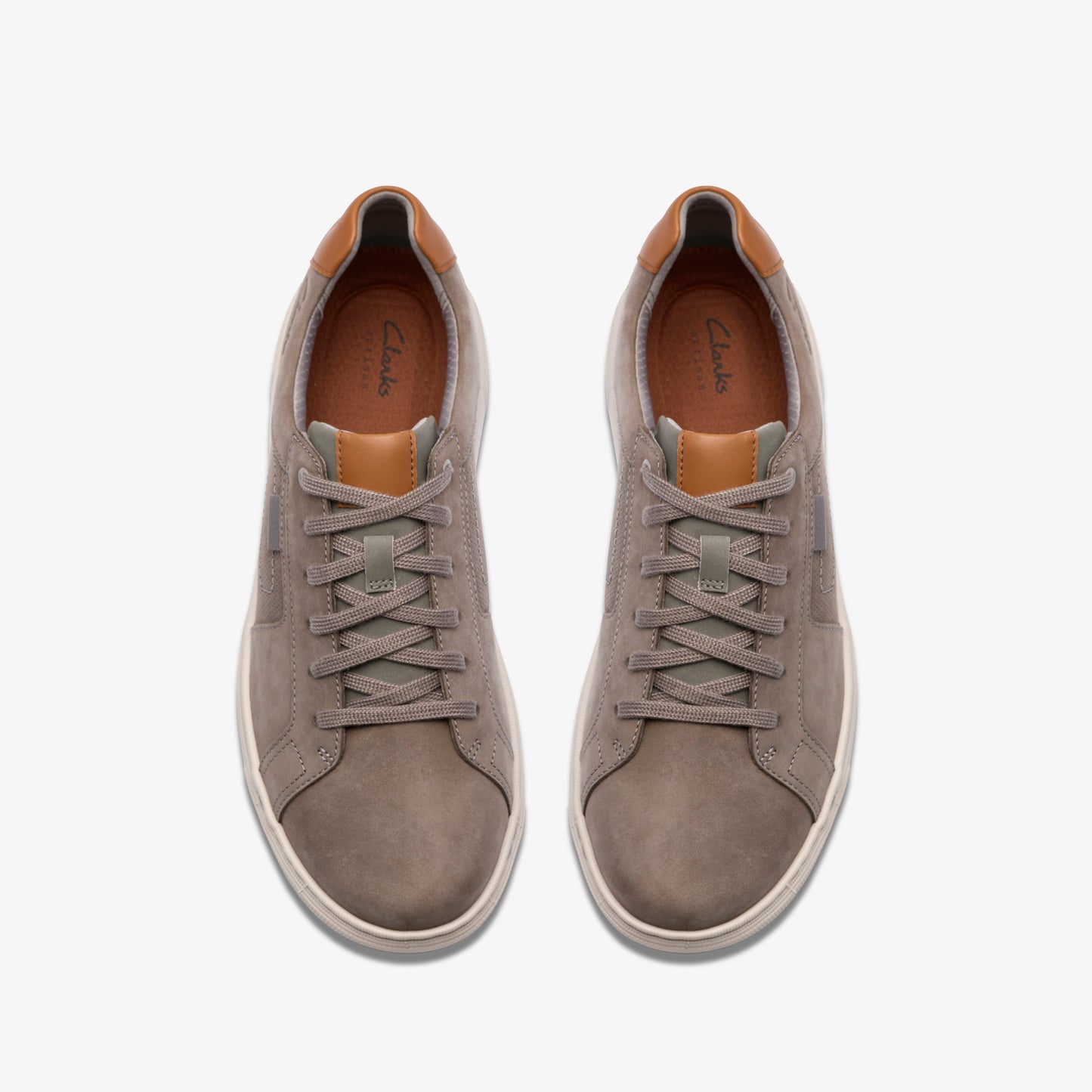 Pair of gray suede sneakers with tan accents, visible laces.