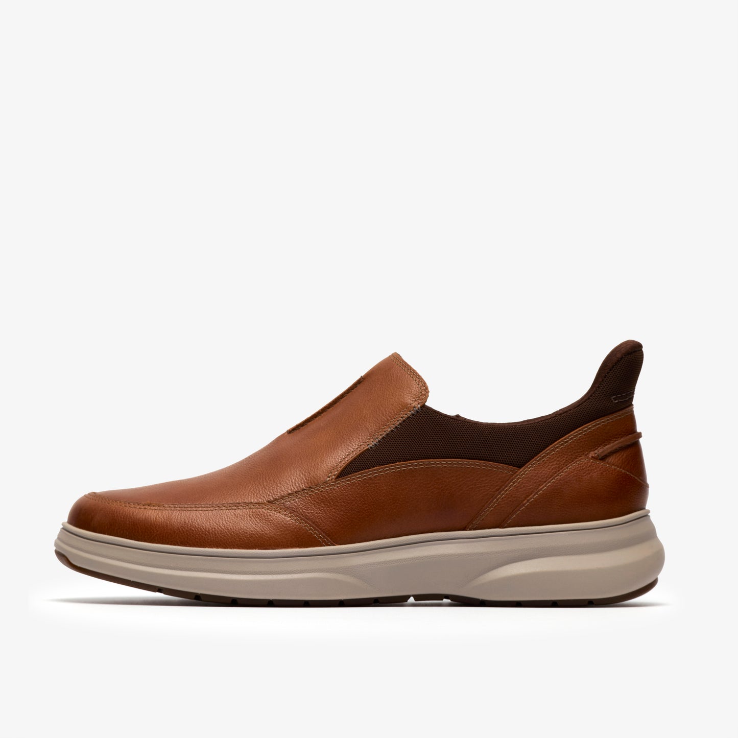 Tan leather slip-on casual shoe with light beige sole.