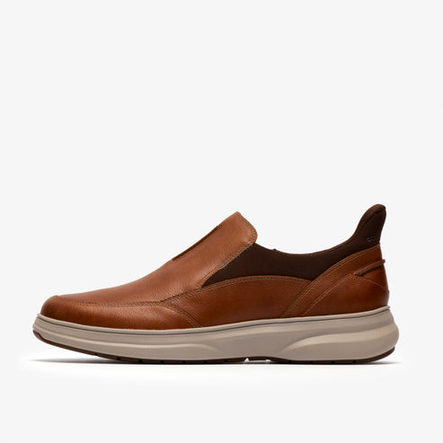 Tan leather slip-on casual shoe with light beige sole.