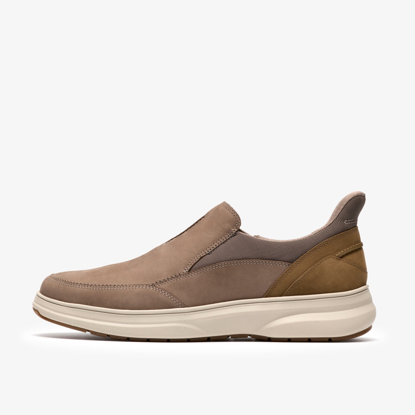 Slip-on taupe shoe with brown heel accent and off-white sole.