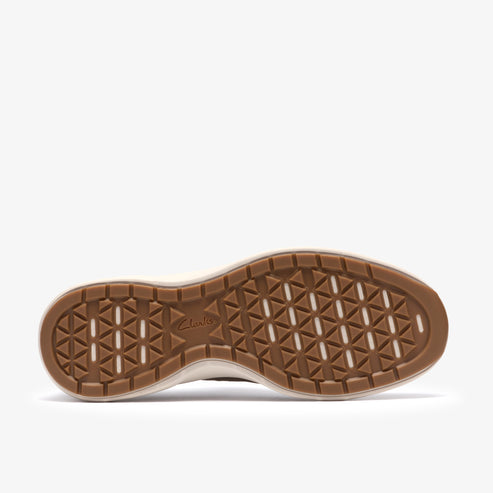 Shoe outsole featuring triangular pattern and "Clarks" imprint.