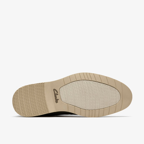 Shoe sole with textured tread and the word 'Clarks' in cursive script.