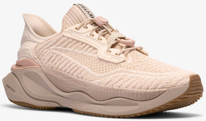 Beige colored running shoe with elastic cord laces and sculpted midsole.