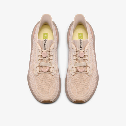 A pair of running shoes, top view, light beige color, with laces and a visible CLARK logo inside.