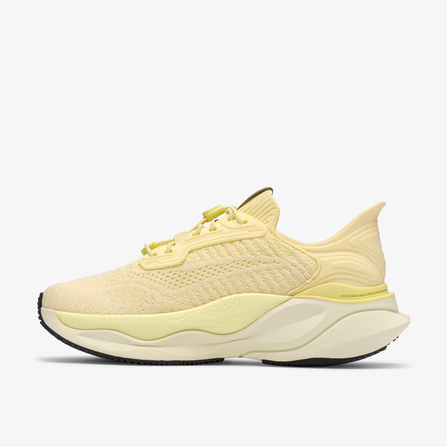A yellow running shoe with a textured upper, sculpted midsole, and black outsole.