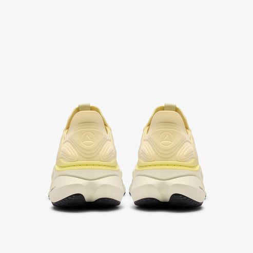Rear view of two yellow running shoes with thick white soles and black outsoles.