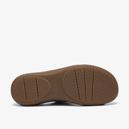 Shoe's brown outsole with a textured pattern.