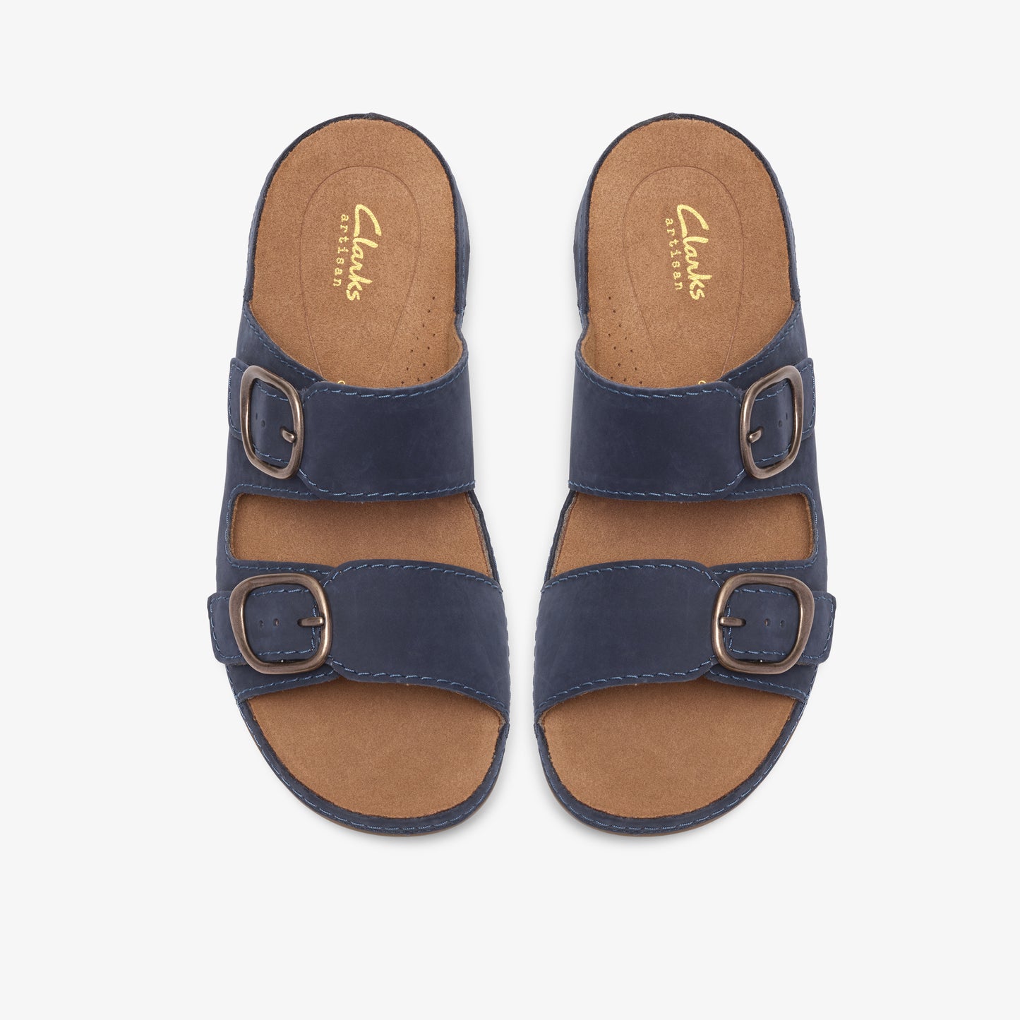 Pair of navy sandals with two straps and bronze buckles.