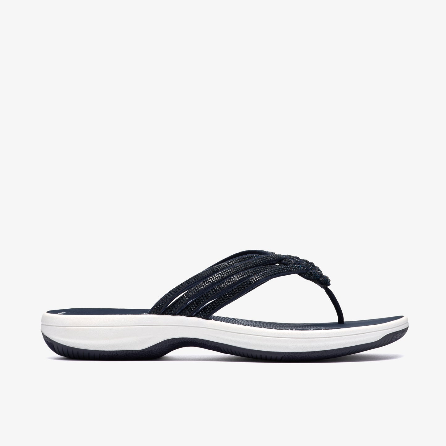 Navy sandal with braided straps and a white sole.