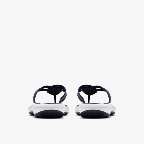 Pair of black and white flip-flops, rear view.