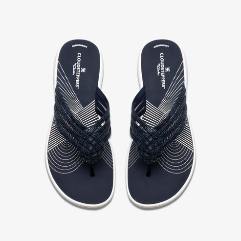Overhead view of dark blue Cloudsteppers flip-flops with woven beaded straps.