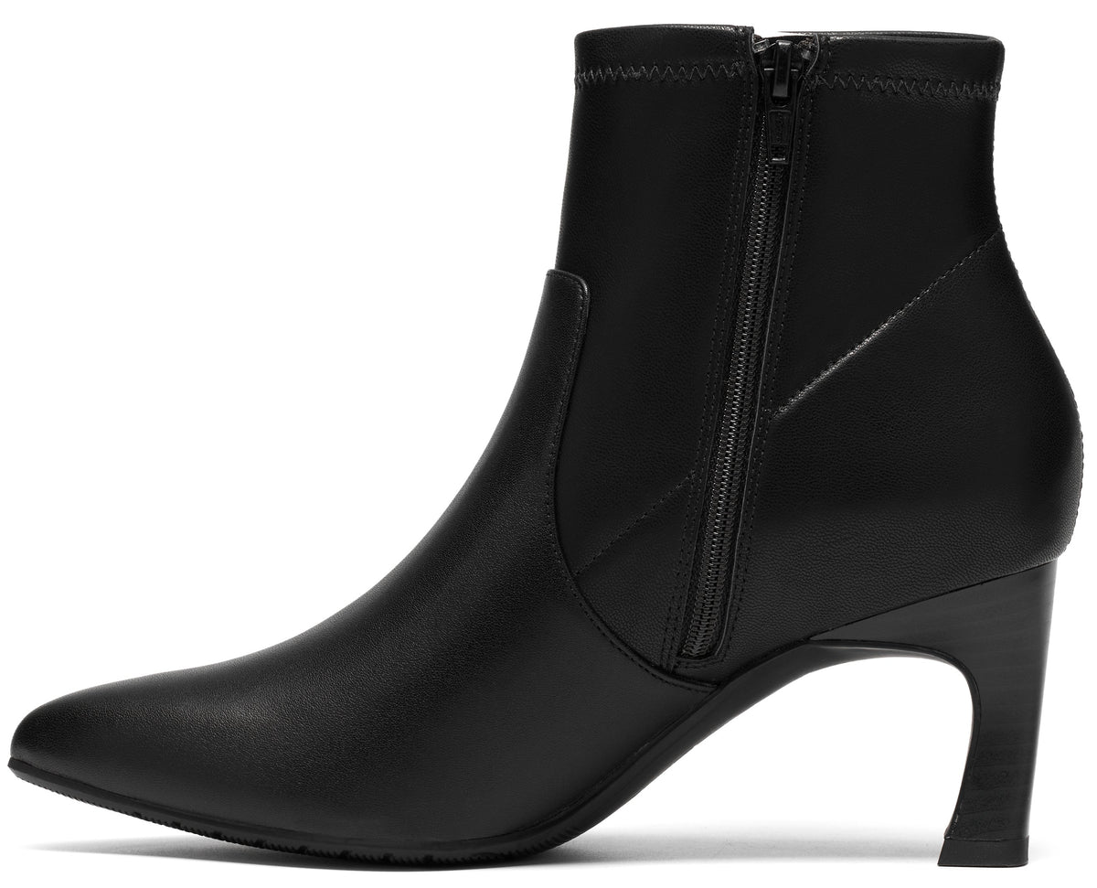 A black faux leather ankle boot with a side zipper, pointed toe, and a low, curved architectural heel.