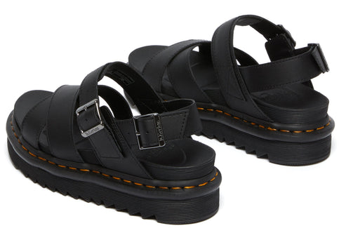 Pair of black sandals with thick soles and orange stitching.