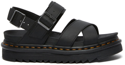 Black sandal with adjustable buckle straps and a thick, ridged sole.