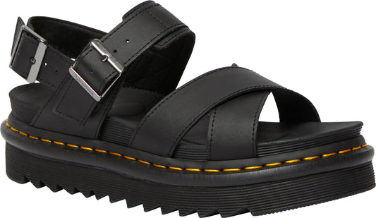 Black leather sandal with cross straps and buckle.