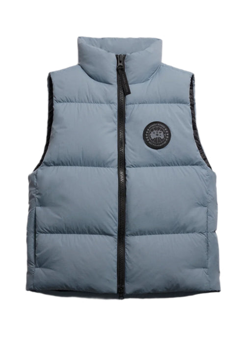 Blue padded vest with black zipper and circular logo.