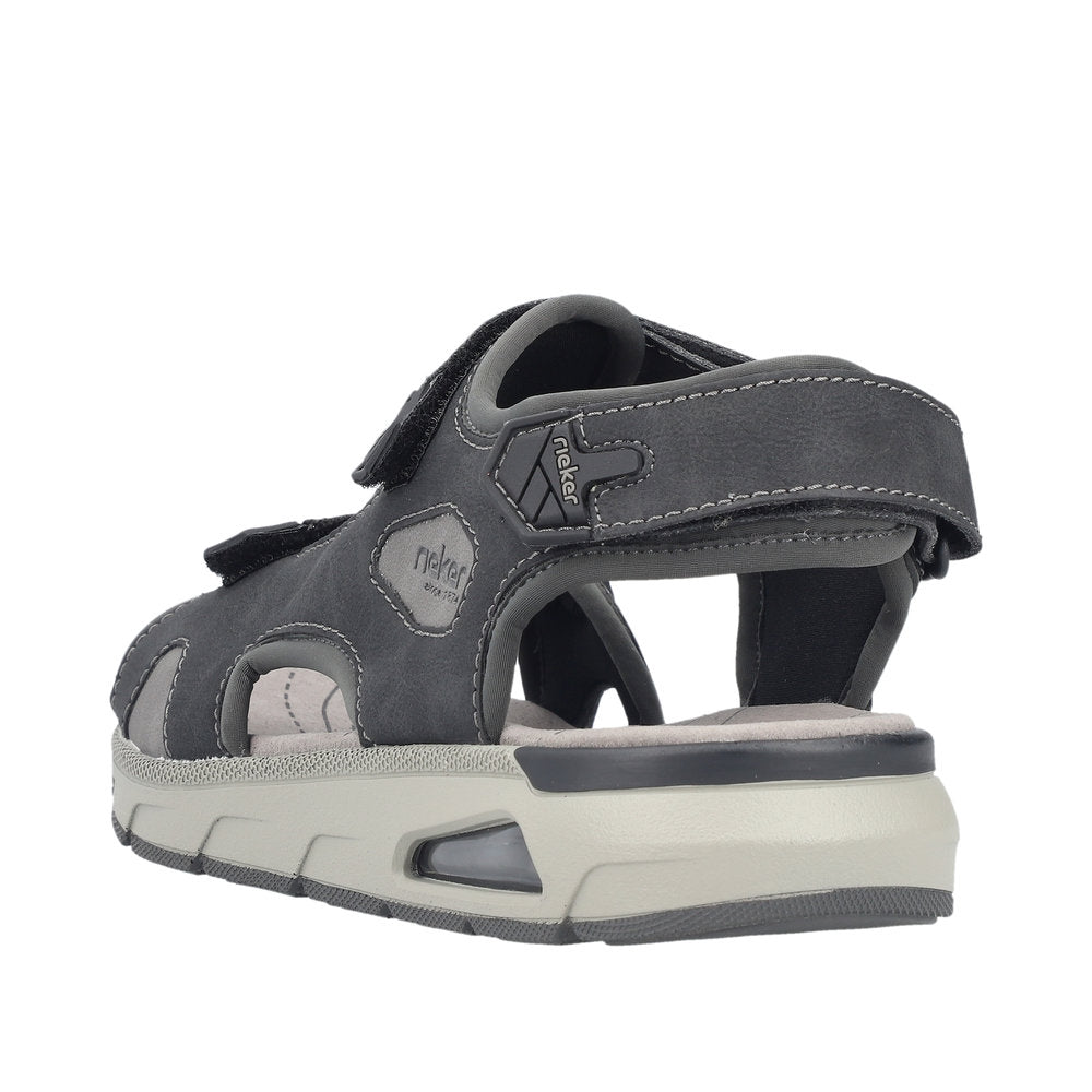 Back view of gray sandal with velcro straps and chunky sole.
