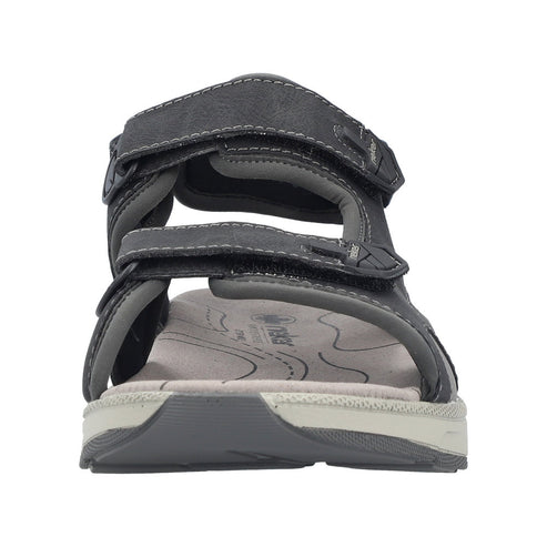 Gray sandal with velcro straps.