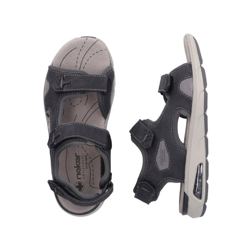 Pair of adjustable dark gray sandals with hook and loop straps and a light gray footbed.