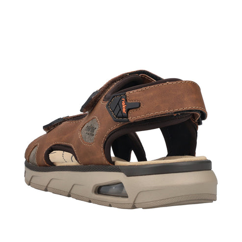 Brown sandal with adjustable velcro straps, platform sole, and black accents.
