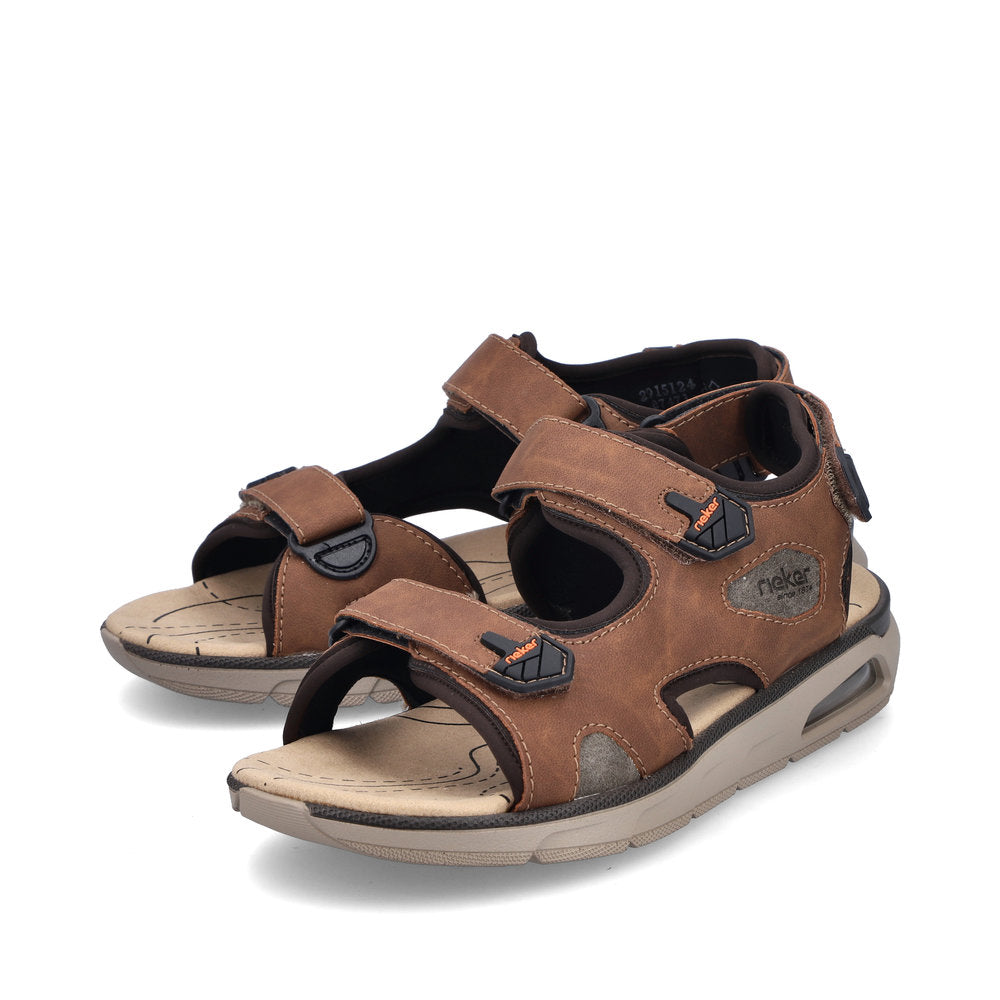 Pair of brown sandals with velcro straps and visible air cushion sole.