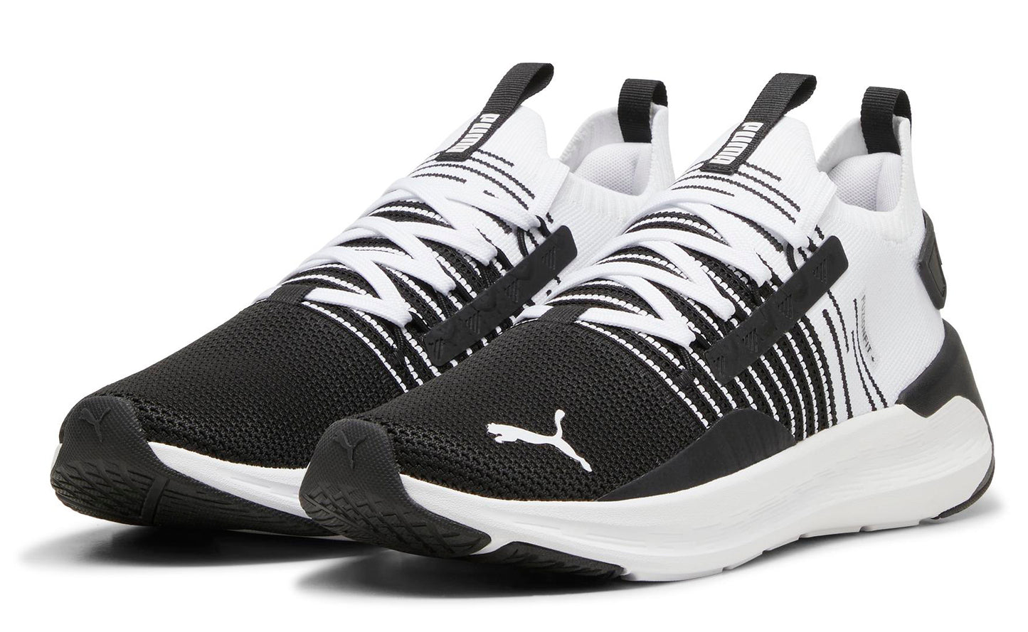 A pair of black and white running shoes with black mesh toe, white laces and sole, and a white logo on the side.