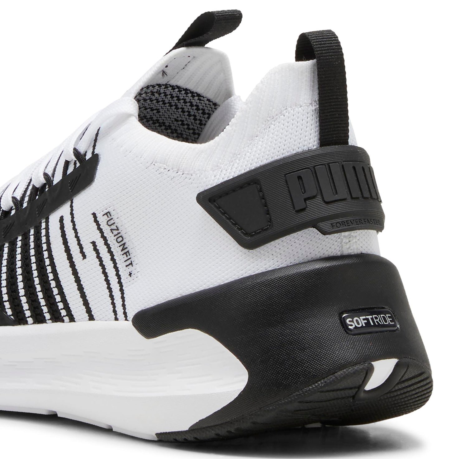 Close-up of a white athletic shoe with black accents and the words "FUZIONFIT" and "SOFTRIDE".