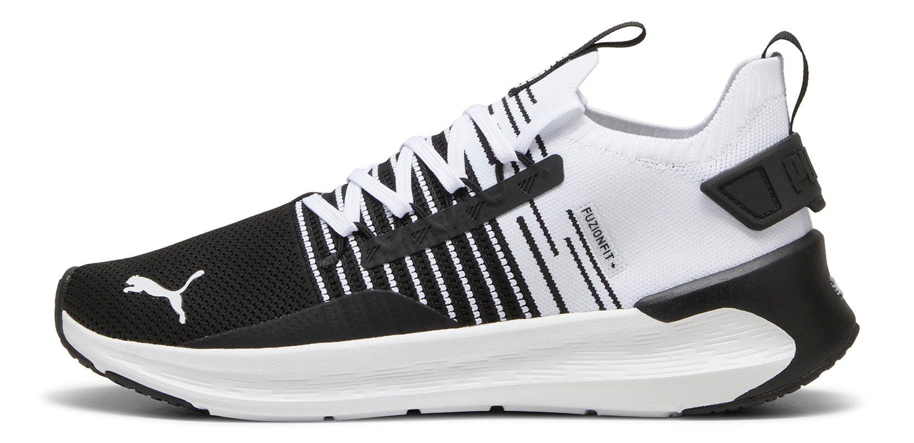 A running shoe with a black toe box, white stripes along the midfoot, and a white heel.