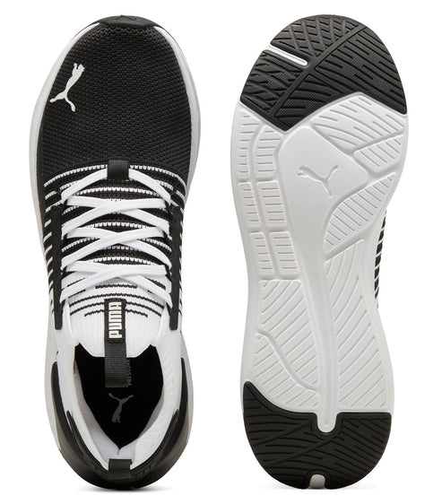 Top and sole view of a black and white athletic shoe featuring white laces and the PUMA logo.