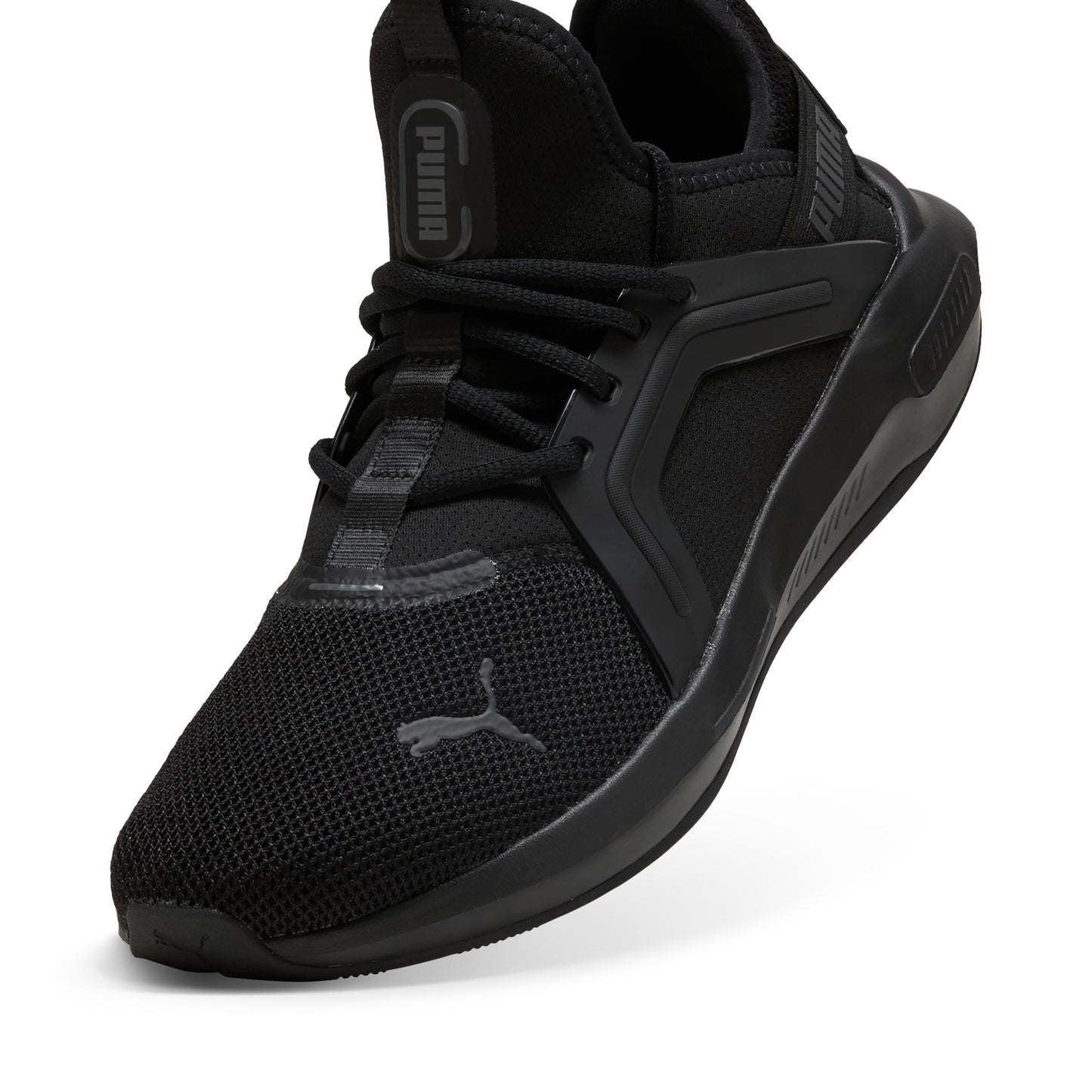 Black athletic shoe with breathable mesh and the word "PUMA" vertically on the tongue.
