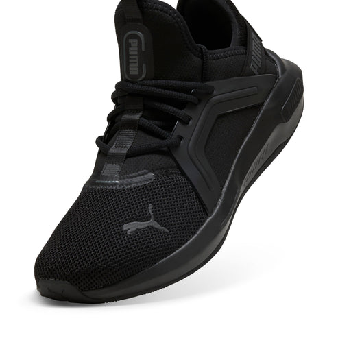 Black athletic shoe with breathable mesh and the word "PUMA" vertically on the tongue.