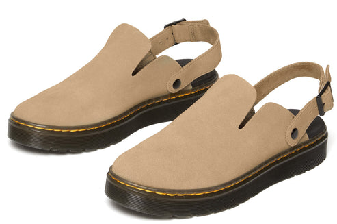 A pair of tan suede clogs with a closed toe, thick black soles, and an adjustable back strap.