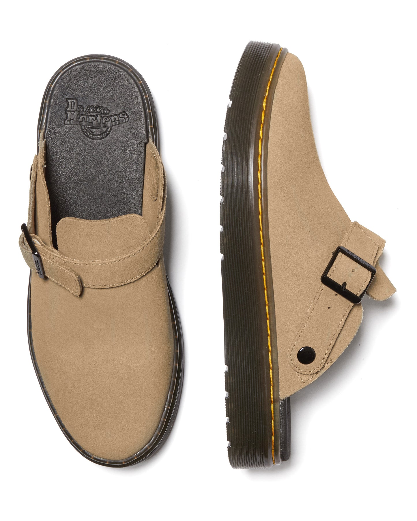 Two tan mules with buckled straps, thick soles and yellow stitching.
